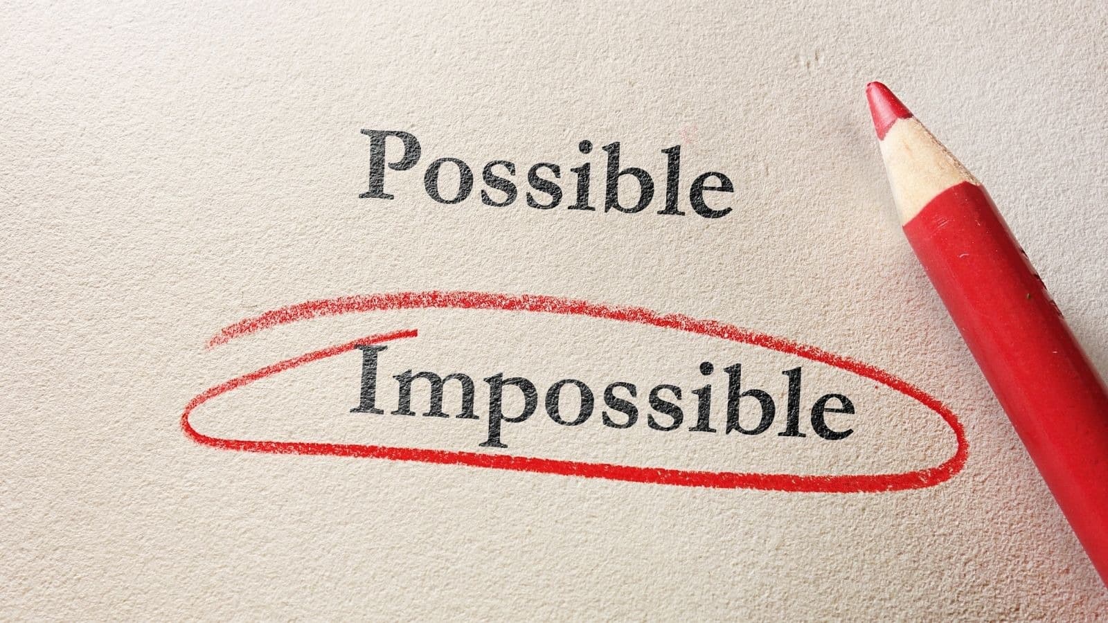Mot impossible transformé en possible au crayon rouge
